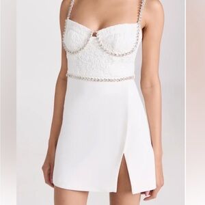 White dress, with lace bodice, outlined corset with quality rhinestones.
